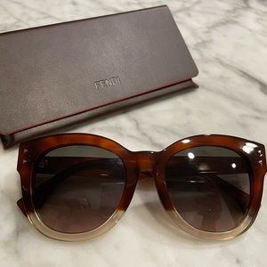 Fendi sunglasses. Brown/tortoise shell top, clear bottom. Lenses = warm, gray.